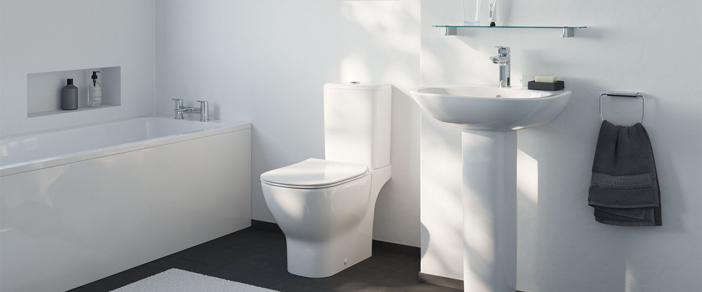 Tesi room setting image showing toilet, basin with full pedestal and straight bath with panels